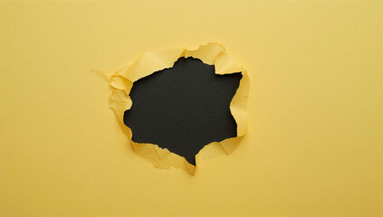 Torn yellow paper reveals a dark mysterious space creative concept