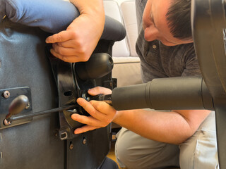 Man Assembling Reclining Chair Mechanism