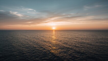 Fototapeta premium Stunning sunset over the ocean with vibrant sky and natural beauty