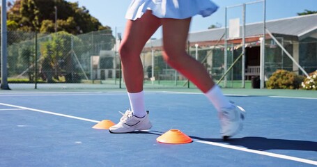 Fitness, feet and cones with agility practice on tennis court for match speed, coordination or health. Athlete, woman and footwork drills outdoor for sports endurance, tournament exercise and running