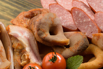 assorted pork meat on a wooden bottom