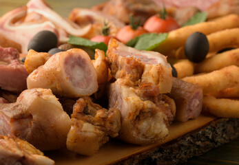 assorted pork meat on a wooden bottom