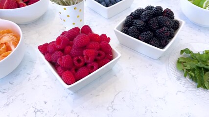 Colorful Array of Fresh Berries and Citrus Fruit on Display