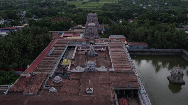 4K aerial drone video of Vaitheeswaran Koil temple and town in Tamil Nadu, India, showing historic architecture, lush green landscape, and peaceful village surroundings.