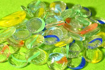 Colorful Glass Ohajiki on Green Background
