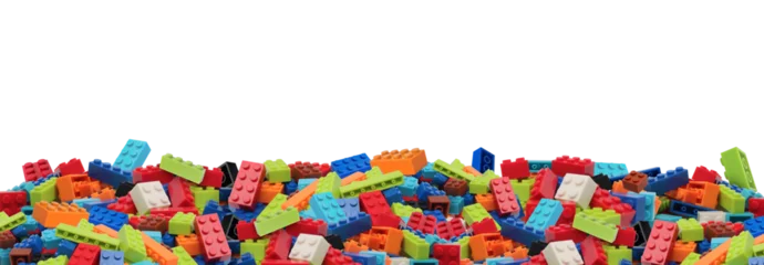 Fotobehang Lego Colorful Plastic Building Blocks Pile on Transparent Background png  © Nofi