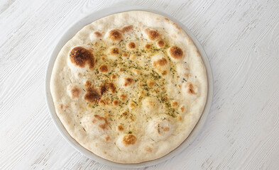 Italian focaccia bread with herbs and olive oil