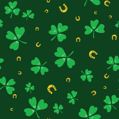 Green gold Saint Patricks Day shamrocks and horseshoes seamless vector pattern. Irish lucky charm motifs. Scattered St. Patricks day symbols for celebration background. Ireland themed backdrop.