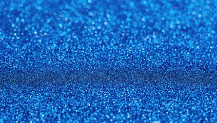 Obraz premium Full frame macro abstract texture background featuring a shimmering blue glitter surface, suitable for editorial header background