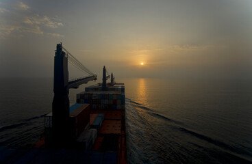 Container ship underway at sea in the morning