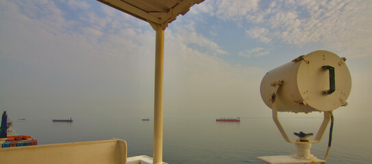 View from the bridge wings of a ship at sea in the Anchorage area in the early morning
