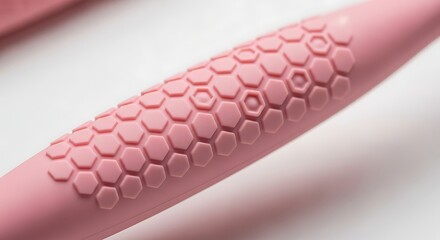Ergonomic Pink Toothbrush Handle Gripped Design Close-up Non-Slip Texture Comfortable Grip Modern Hygiene Technology Oral Care Wellness Product