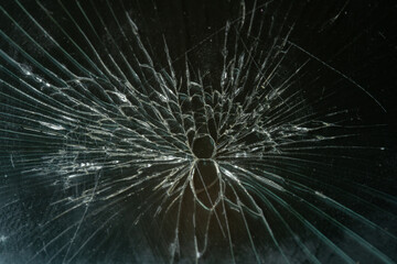 Shattered Dark Glass Screen with Spiderweb Crack Pattern