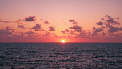 Fototapeta premium Evening Sea View with Vibrant Orange Clouds at Sunset