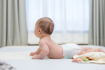 Cute baby crawling on soft floor mat