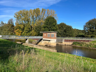 river and bridge with blue sky in landscape