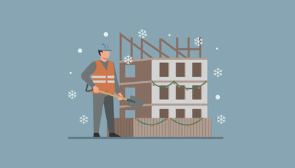 Construction worker with shovel at a winter building site decorated for the holidays