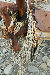 Old sea nets, fishing  gear, rusty iron on the ocean coast