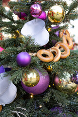 A close-up of a decorated Christmas tree with twinkling decorations. A Christmas tree decorated...