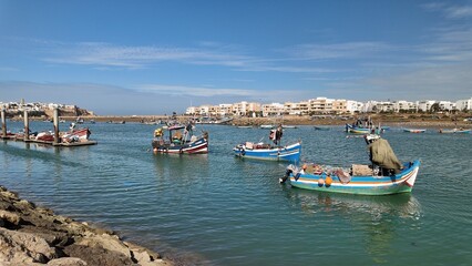 Fototapeta premium Traditional Fishing Boats Docked on the Bouregreg River in Rabat, Morocco – October 8,2025 