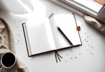 Open notebook with pen, coffee cup, and confetti on white surface
