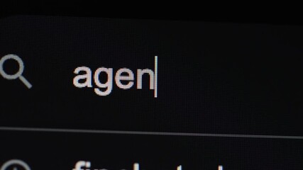 A close-up view of the company name "Agentive" being typed into a search bar
