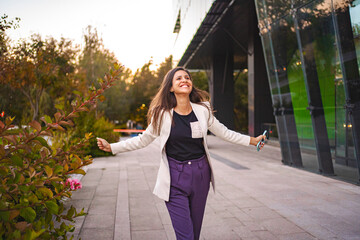 Smiling businesswoman feeling excited after finnshing work