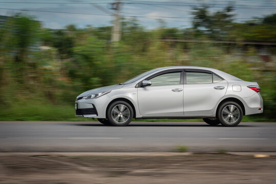 Nakhonsawan, Thailand - Oct, 2025: Toyota Corolla Altis, A silver car to speed running on the highway, on October 24, 2025, at Nakhon Sawan, Thailand.