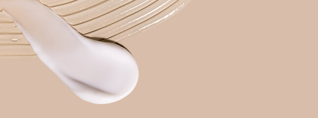 samples of cosmetic care products smear of cream gel texture on a beige background, moisturizing and skin care concept