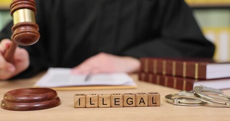 Judge deliberates over case as the word 'illegal' is spelled out in front, conveying a serious moment in the courtroom - Powered by Adobe