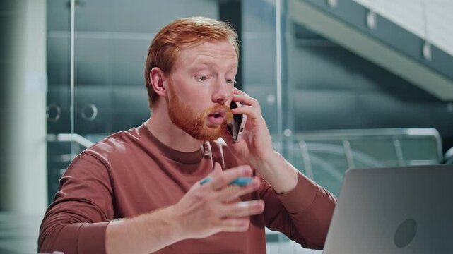 Burnout Emotional Load, Office Stress, Mental Fatigue. A Worn-Out Man Works at His Desk in a Modern Office, Struggling With Overload and Tension. A Realistic Scene of Pressure and Emotional Exhaustion