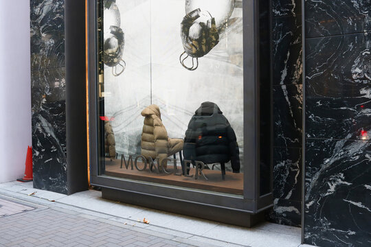 TOKYO, JAPAN - October 30, 2025: Moncler store in Tokyo with a window display with part an advertising campaign involving Robert de Niro and Al Pacino. 