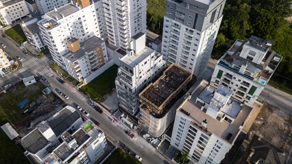 Fototapeta premium House Construction Framing Site Buildings Architecture Structure Wooden Frame Engineering Work Housing Development Residential Area Square Frame Modern Design Construction Industry