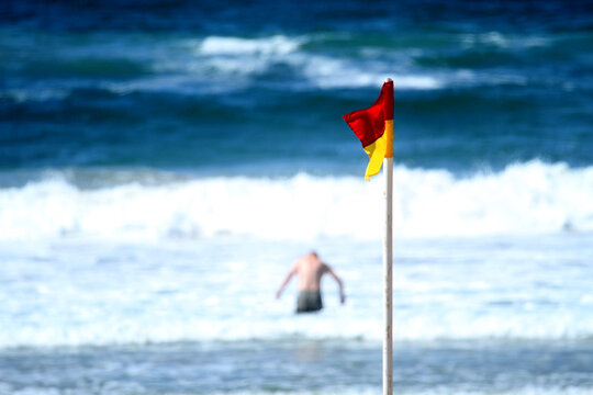 Lonely swimmer in the ocean