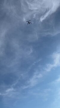 the drone's takeoff from the rocky coast over the sea into the sky