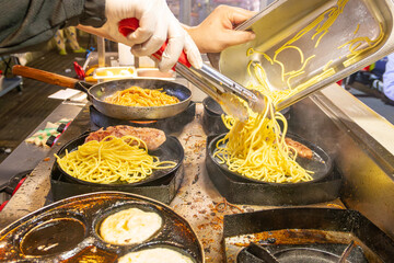 cooking steak spaghetti at horizontal composition