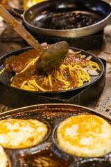 cooking steak spaghetti at vertical composition