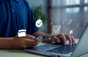 Man using smartphone and laptop with digital icons of security check, data protection, and file management. Concept of online verification, cybersecurity, secure login, and digital data privacy.