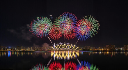 Fireworks display in vibrant explosive style in red, green, and blue colors representing a city celebration with copy space