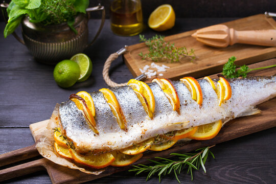 Whole roasted salmon on serving board