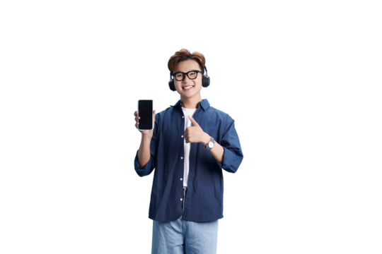 Modern Connection: A young man, styled in smart casual attire, engages with the viewer, offering a glimpse of the digital world through a mobile device. He wears headphones. With a thumbs up gesture.
