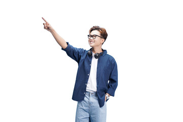 Pointing the Way: A young man with glasses and headphones points confidently upwards, exuding a...