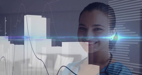 Indian doctor in blue scrubs studying digital charts in clinic room, with stethoscope, copy space © vectorfusionart