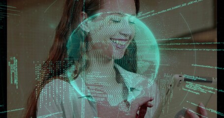 Interacting woman in collared blouse viewing tablet at office, with digital globe and code