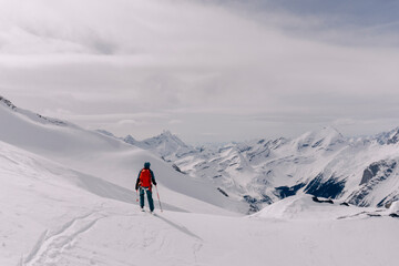 Skiers enjoy a backcountry tour in the Northern Rockies of British Columbia, Canada.