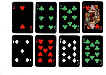 Obraz premium A hand of vintage playing cards isolated on a white background.