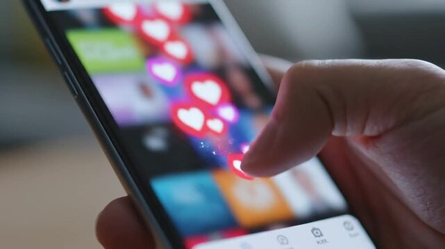 Social Media Engagement - A Close-Up Look at Liking Posts on a Smartphone.