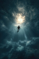 Scuba diver ascending in deep blue ocean water