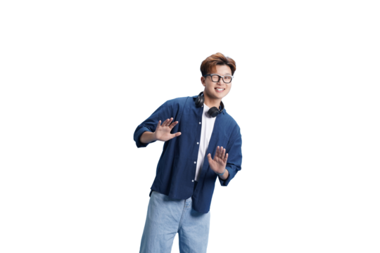 Expressive Moment: A young man exudes a lively and energetic persona, his arms outstretched as he gestures with vibrant enthusiasm.