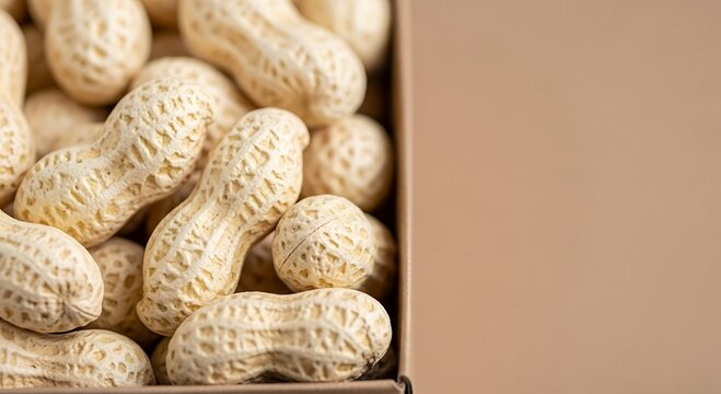 Delicious raw peanuts packed in a cardboard box, perfect for healthy snacking and culinary creations, offering natural protein and flavor. - Powered by Adobe
